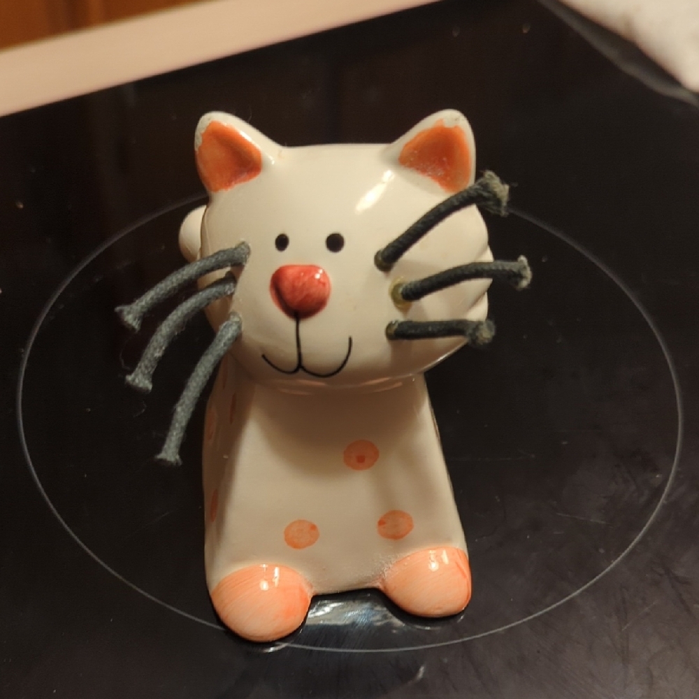 Playful Ceramic Cat Figurine with Orange Spots